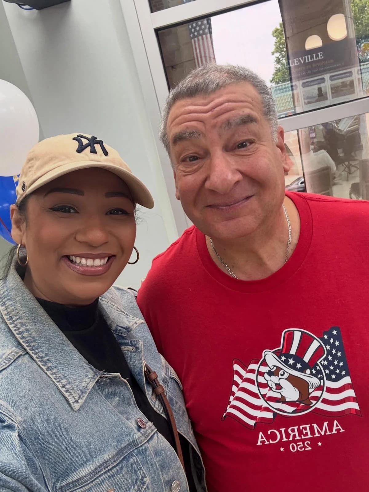 Assemblywoman Carmen Morales smiling beside a man in an indoor selfie